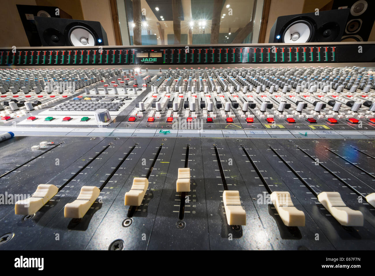 Wide angle view of sliders on a music recording mixing desk Stock Photo