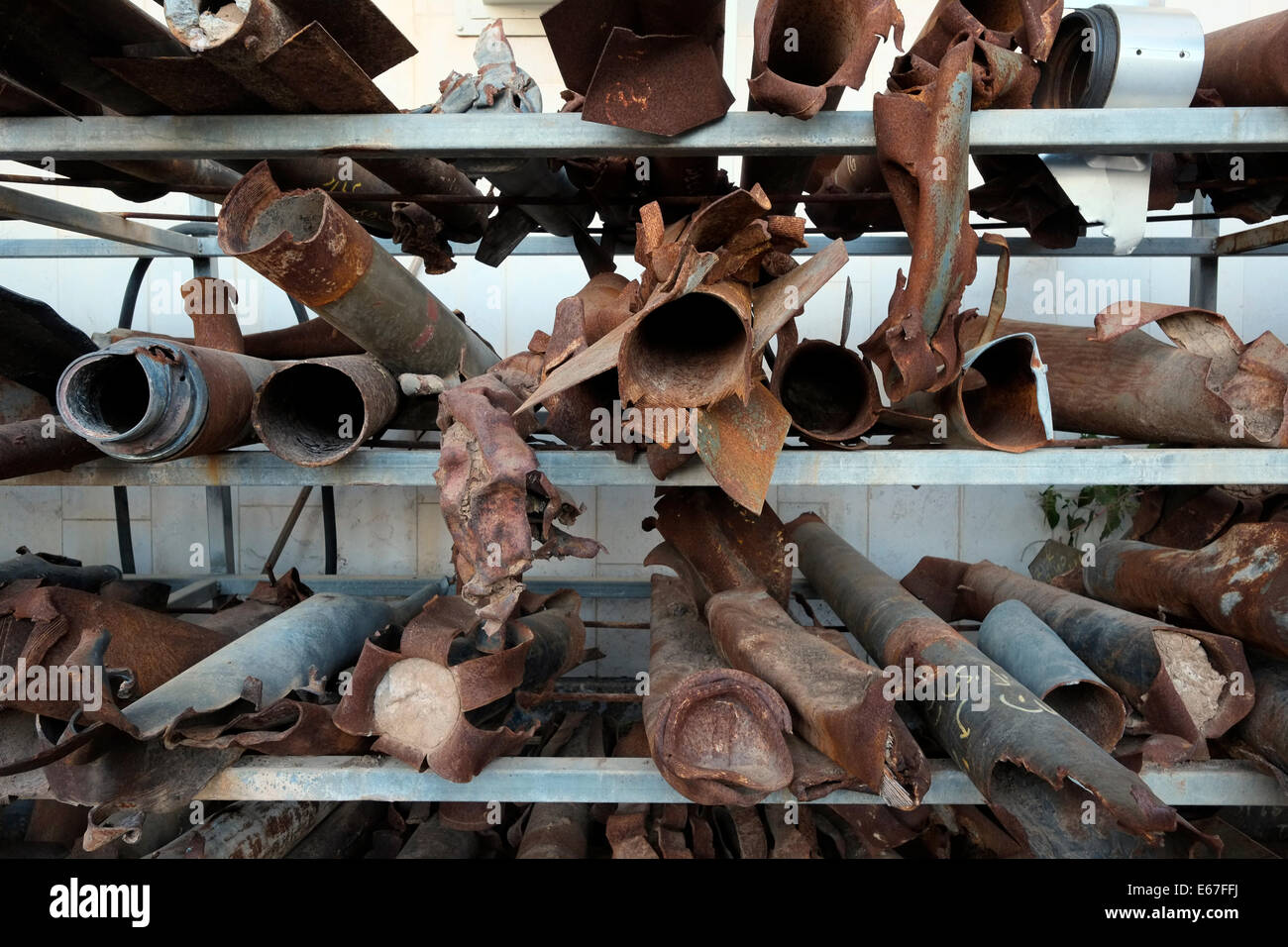 Remnants of several types of exploded Qassam rockets that were fired by Palestinian militants from Gaza Strip to southern Israel is displayed at the police station in the town of Sderot southern Israel Stock Photo