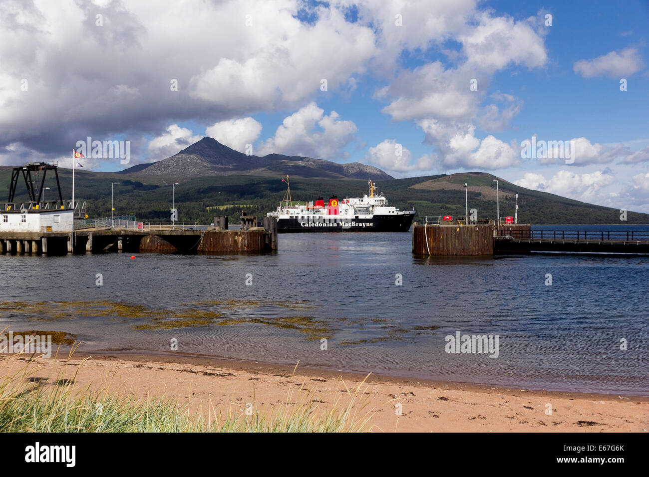 At Brodick, the Isle of Arran ferry service run by Caledonian MacBrayne from Ardrossan. Mountains of Arran in the background, in Stock Photo