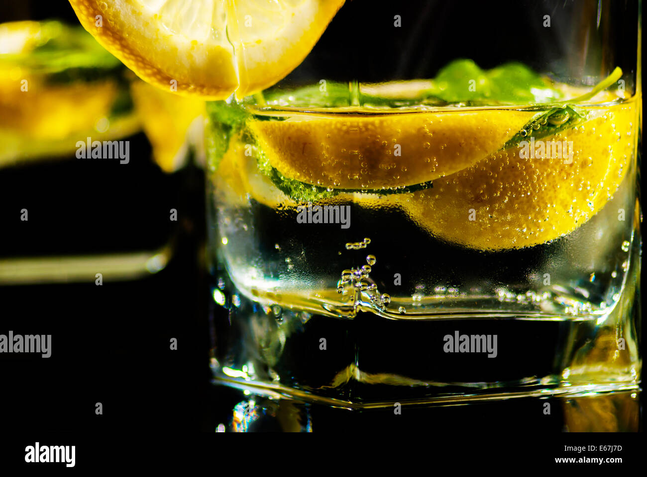 Drink water with lemon and mint on reflect background Stock Photo