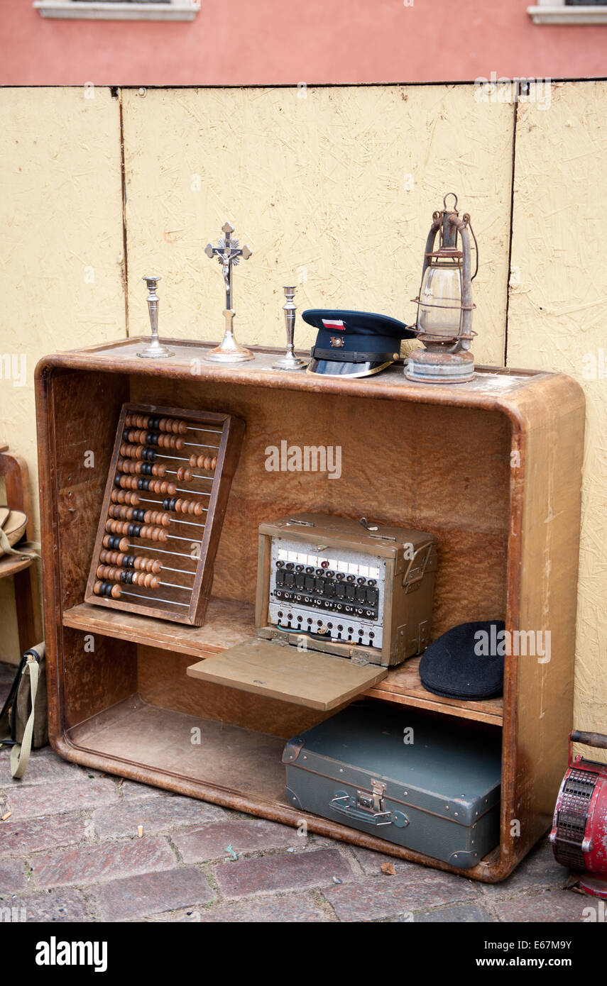 Old retro wood abacus, radio, beret, cross, candleholder, oil lamp and radio Stock Photo