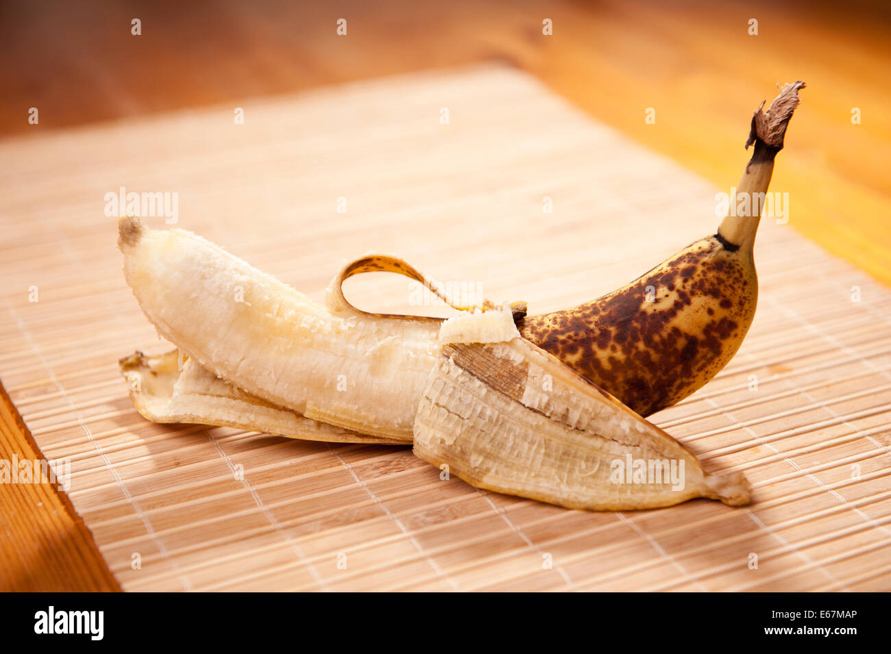 Old bad banana fruit lying on table Stock Photo