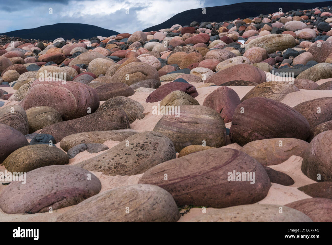 The coloured boulders at Rackwick bay, Hoy, Orkney, Scotland Stock Photo