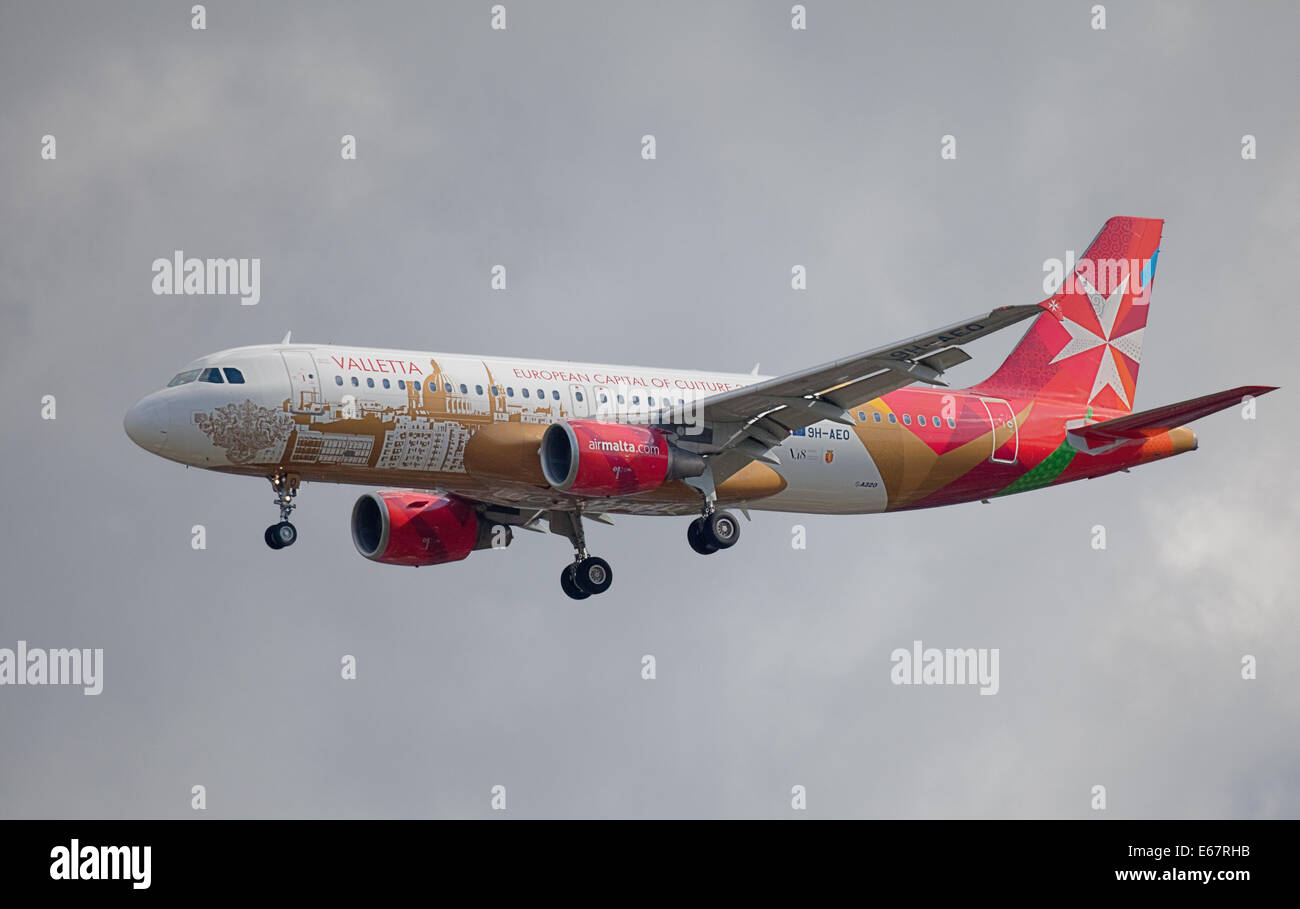 Air malta airbus a320 taking off form heathrow airport hires stock