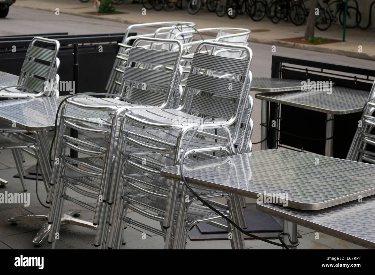 Stacked stainless steel chairs. Stock Photo
