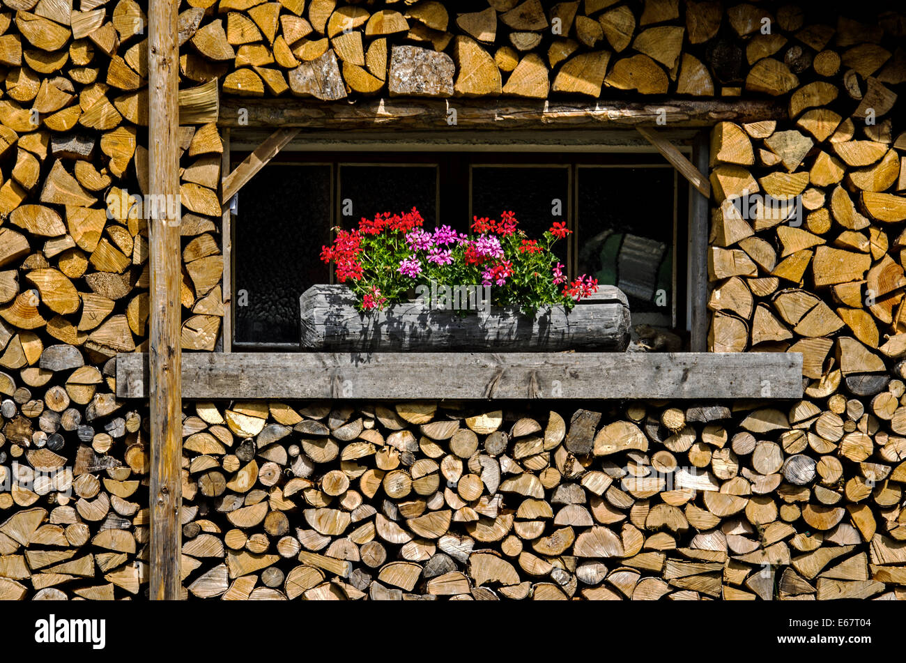 Summertime, fireword being stored for the coming winter in the Chamonix Valley in the French Alps. Stock Photo