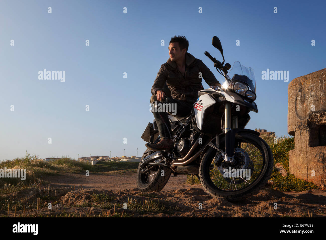 Portrait of a young man on a motorcycle Stock Photo