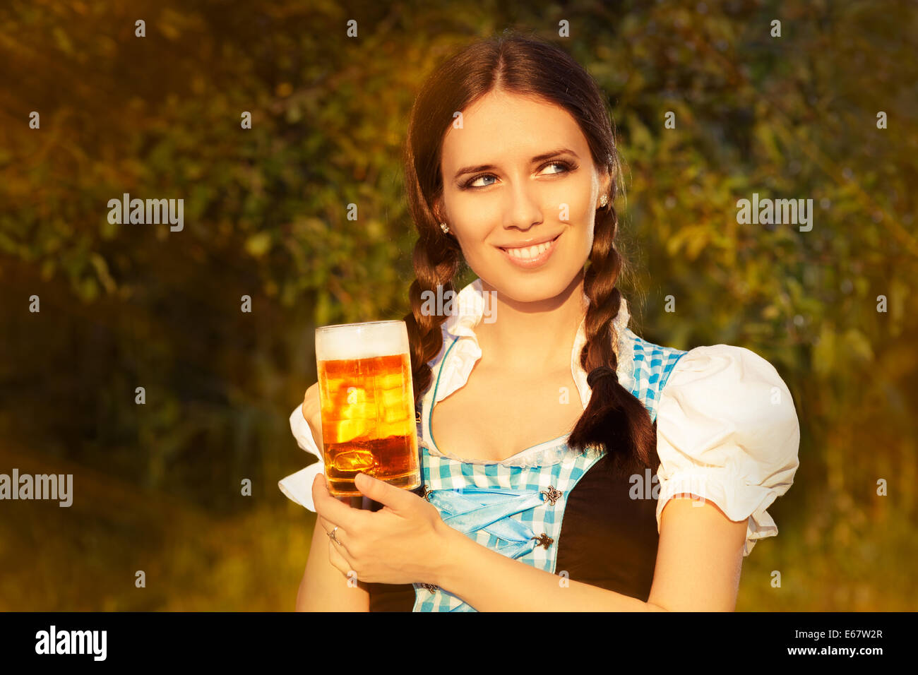 Young Bavarian Woman Holding Beer Tankard Stock Photo