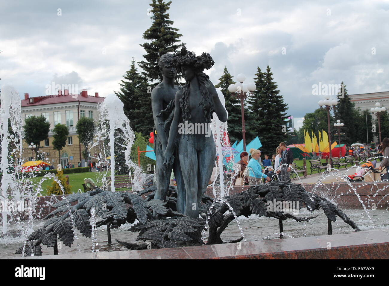 shape of two young people cast in bronze decoration for public city fountain Stock Photo