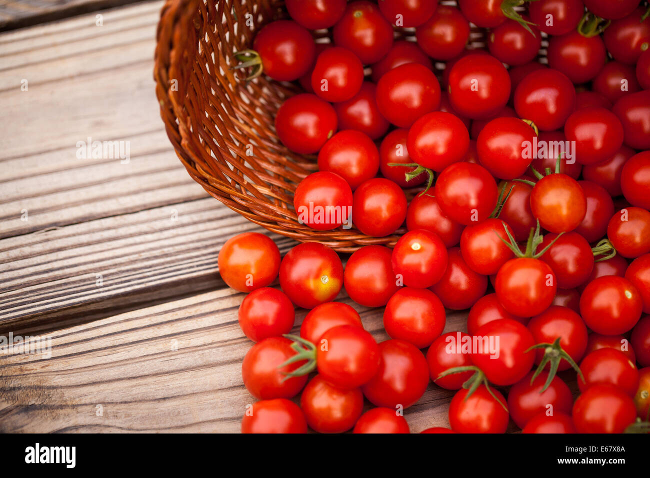 Home garden,ripe cherry tomatoes on a wooden background Stock Photo - Alamy