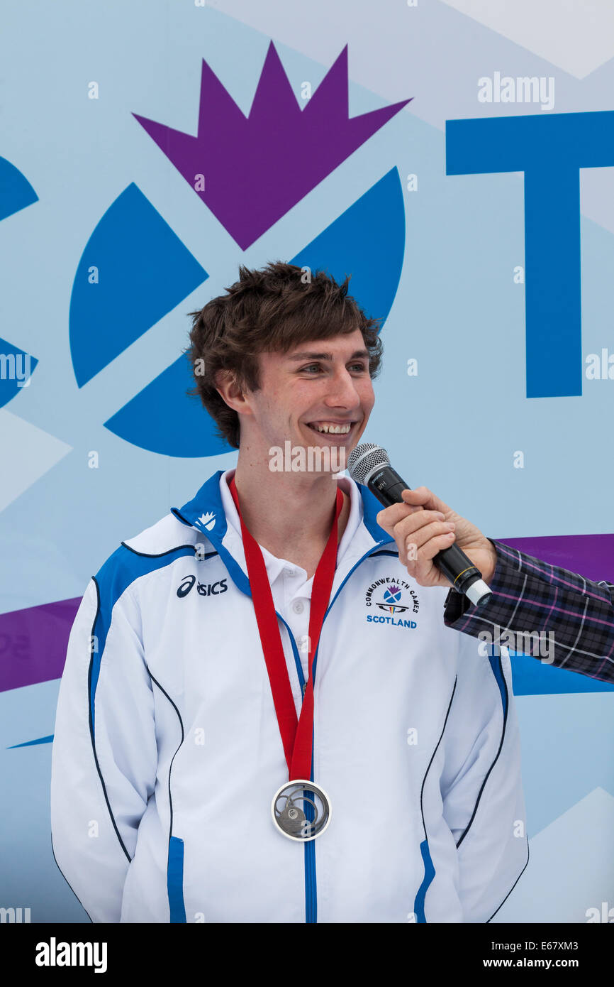 Liam Davie, member of the Scottish Silver Medal Gymnastics squad, in George Square after Team Scotland parade through Glasgow. Stock Photo
