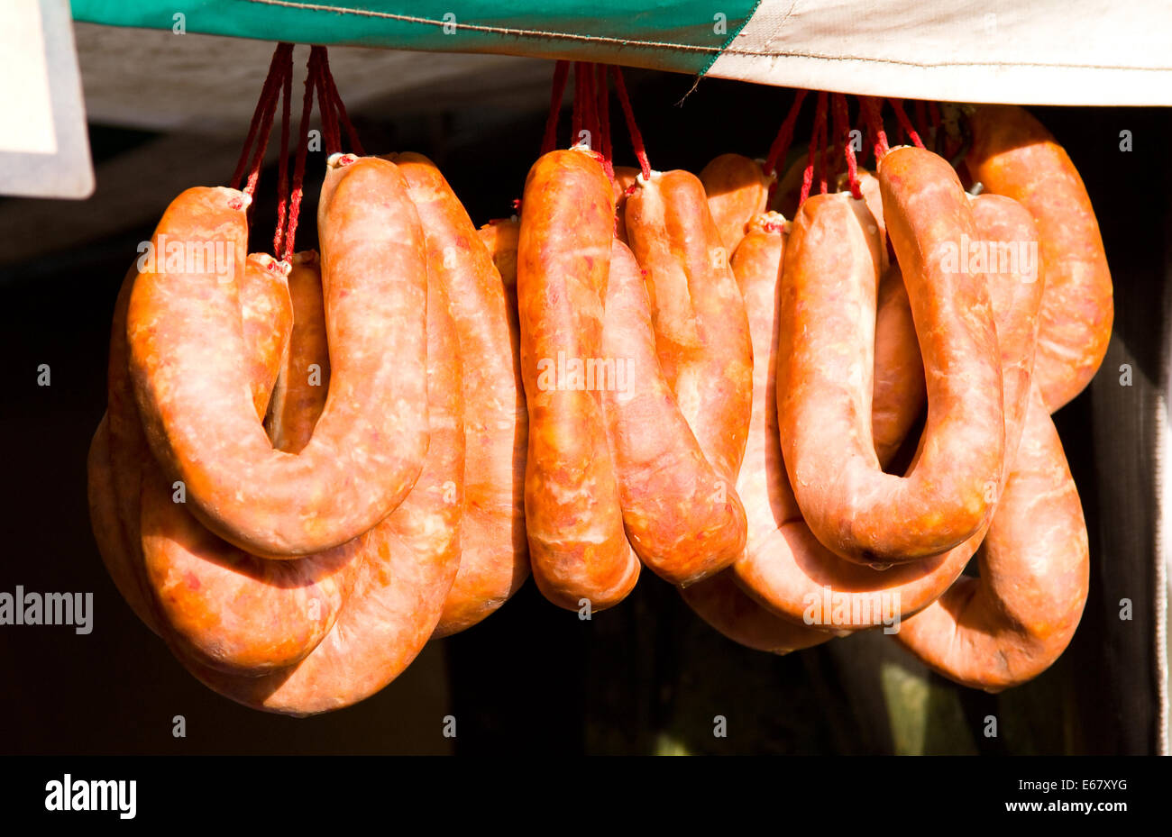 hanging sausages at a farmers market. Stock Photo