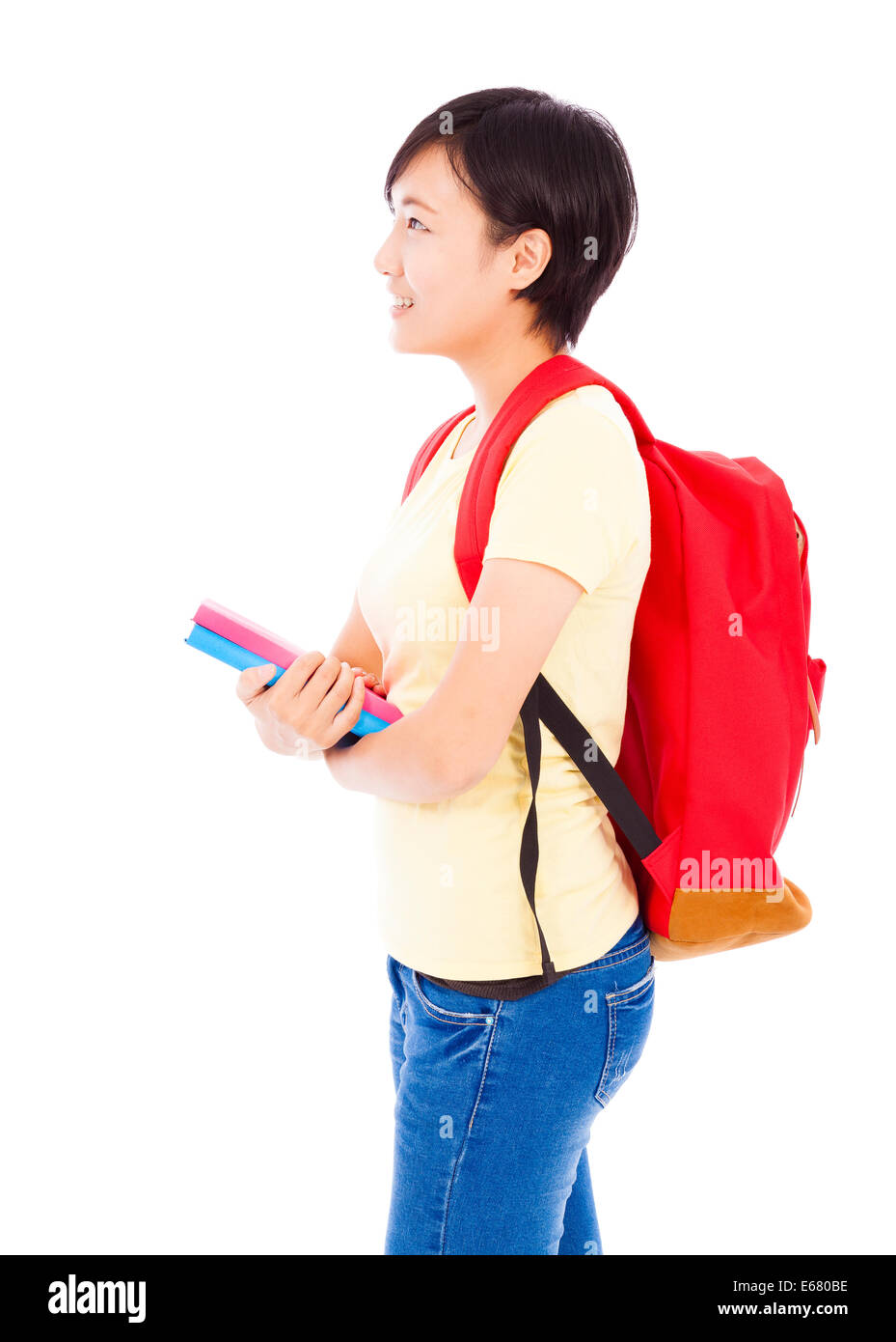 young student girl standing and holding book over white background ...