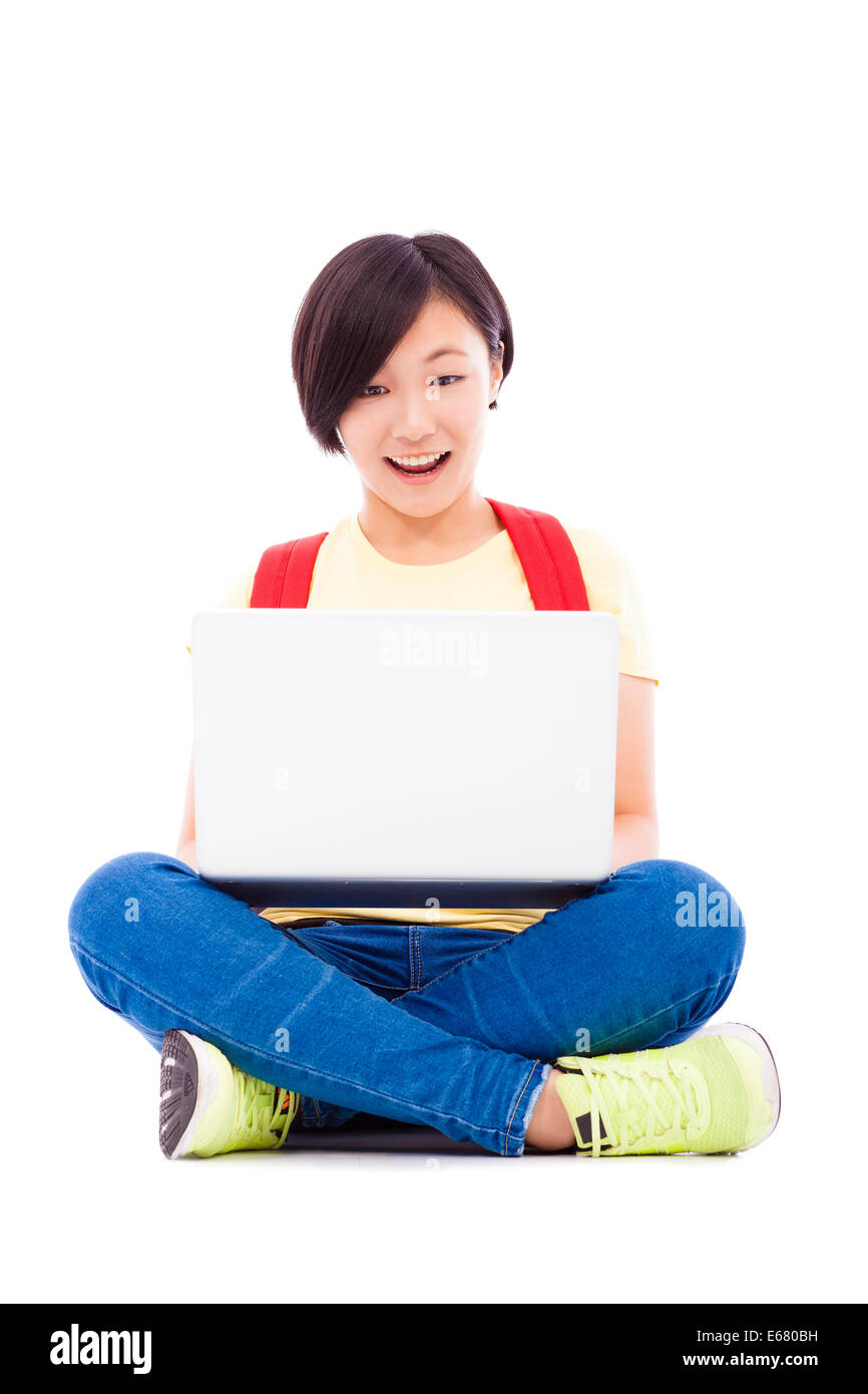 Smiling young student girl sitting with a laptop Stock Photo - Alamy
