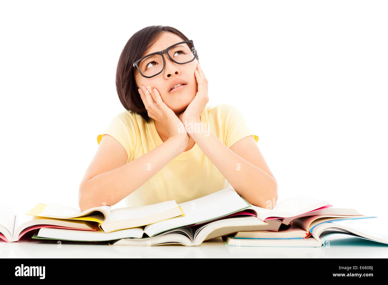 young student girl thinking with book on the desk Stock Photo - Alamy