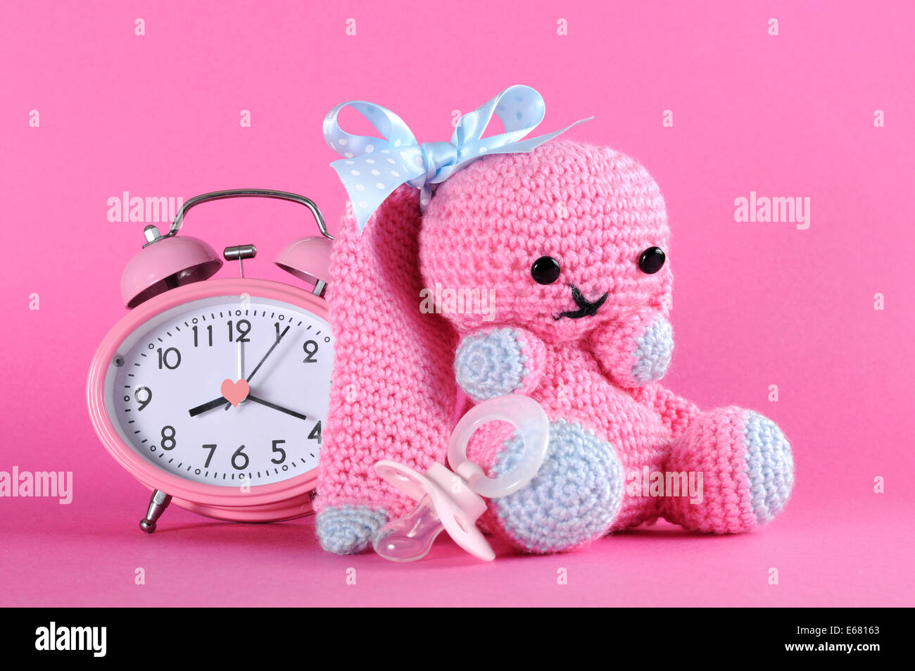 Baby girl nursery cute bunny toy, dummy pacifier and clock for on pink