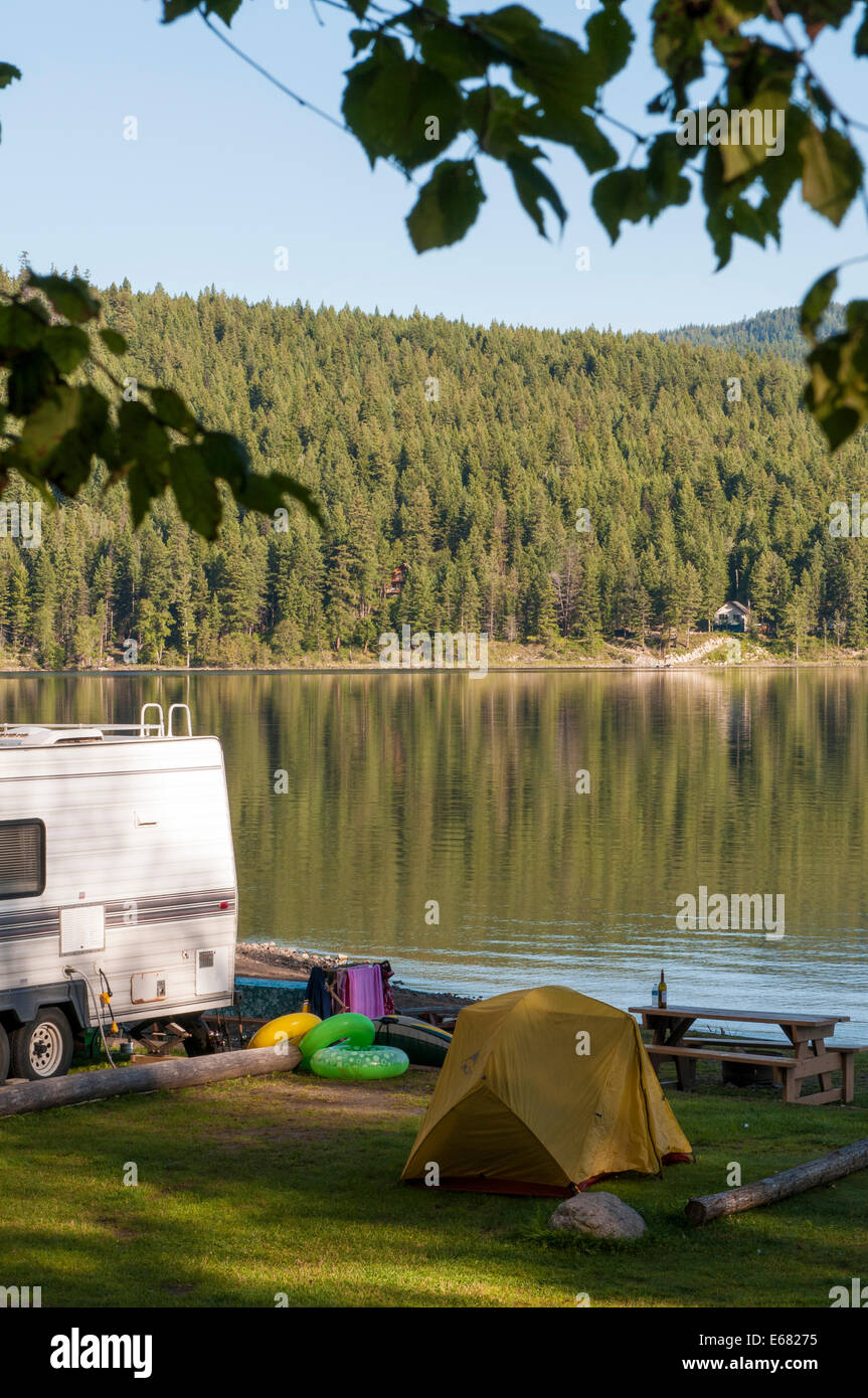 RV travel trailer campsite camping tent at Canim Lake, British Columbia, Canada. Stock Photo