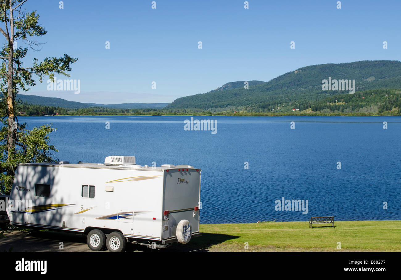 RV travel trailer campsite camping at Canim Lake, British Columbia, Canada. (PR) Stock Photo