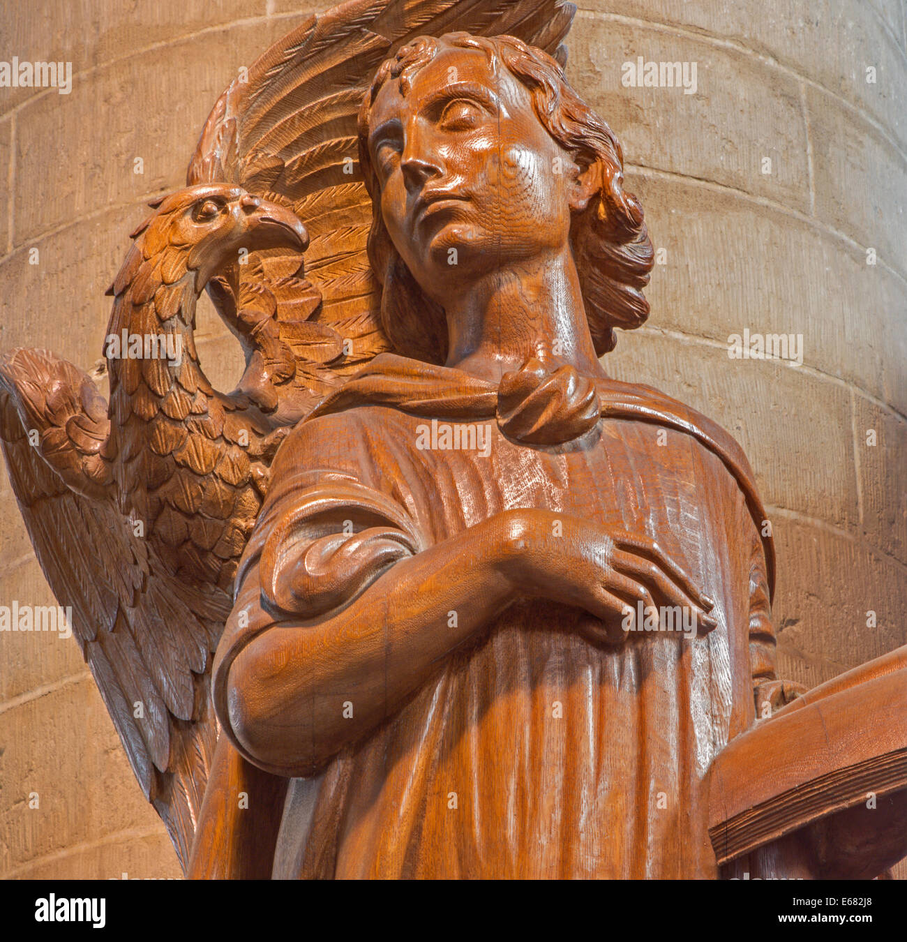 Mechelen - Modern carved statue the Inspiration of Saint John the Evangelist by Ferdinand Wijnants in st. Johns church Stock Photo