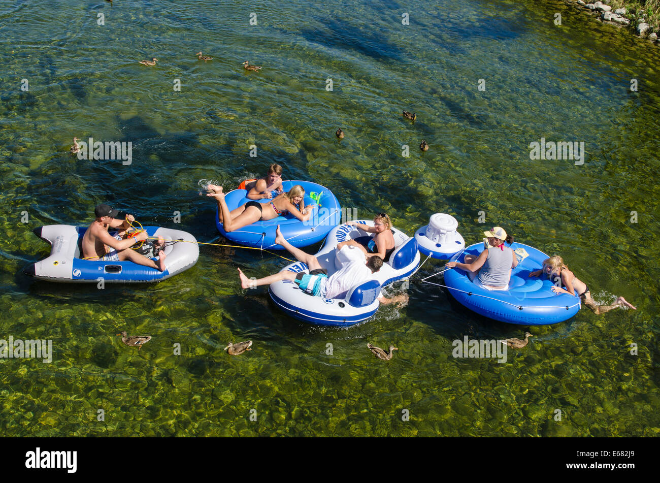 Inner tubing rafting floating on the Penticton River, Penticton, BC