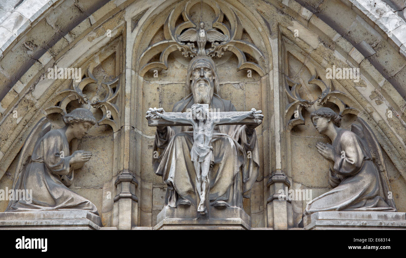 BRUSSELS, BELGIUM - JUNE 15, 2014: The Holy Trinity on the east portal of Notre Dame de la Chapelle gothic church. Stock Photo
