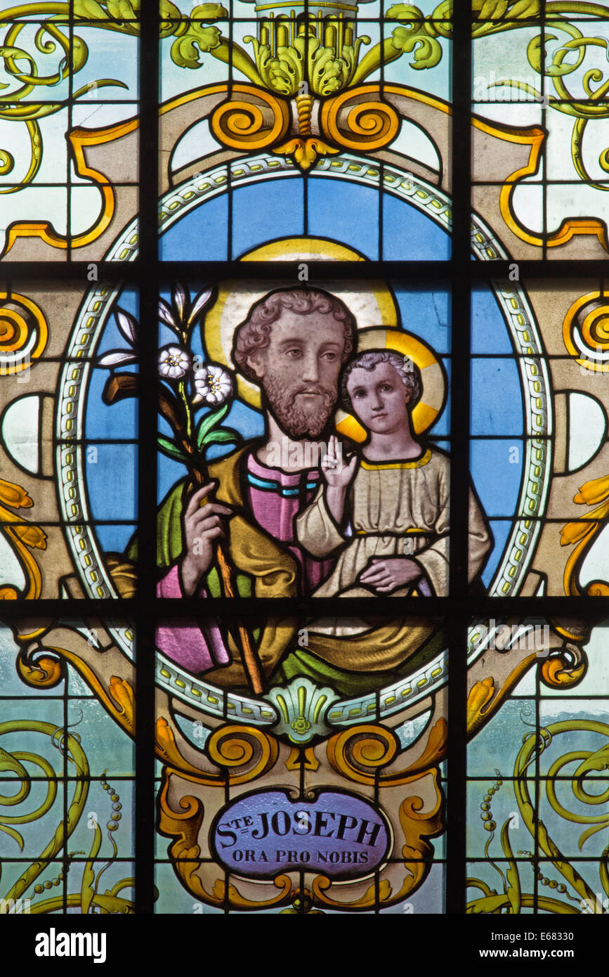 BRUSSELS, BELGIUM - JUNE 15, 2014: St. Joseph on the windwopane in church Notre Dame aux Riches Claires by Jan van Keer (1904) Stock Photo