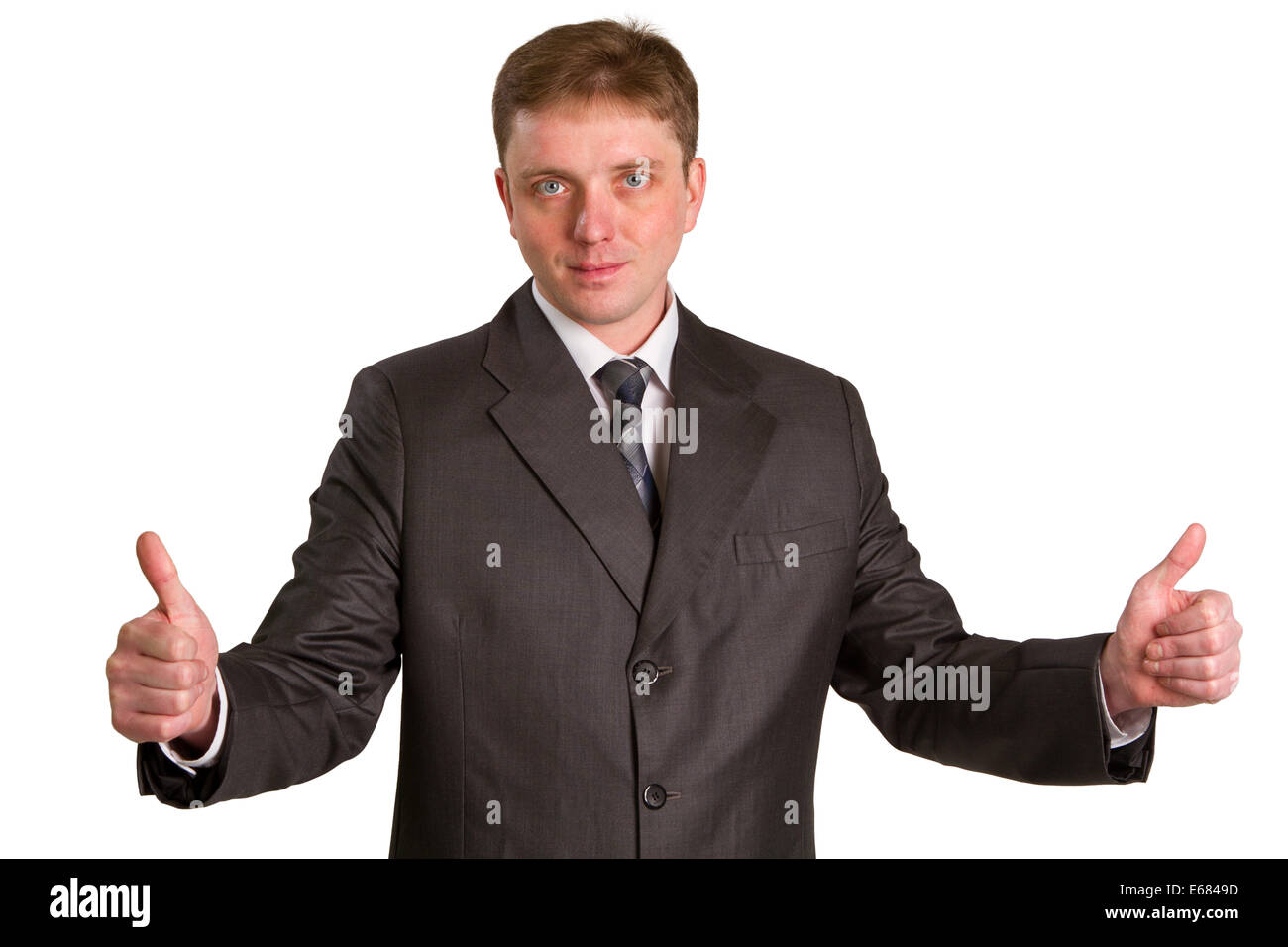 Happy businessman showing his thumbs up with smile over white background Stock Photo