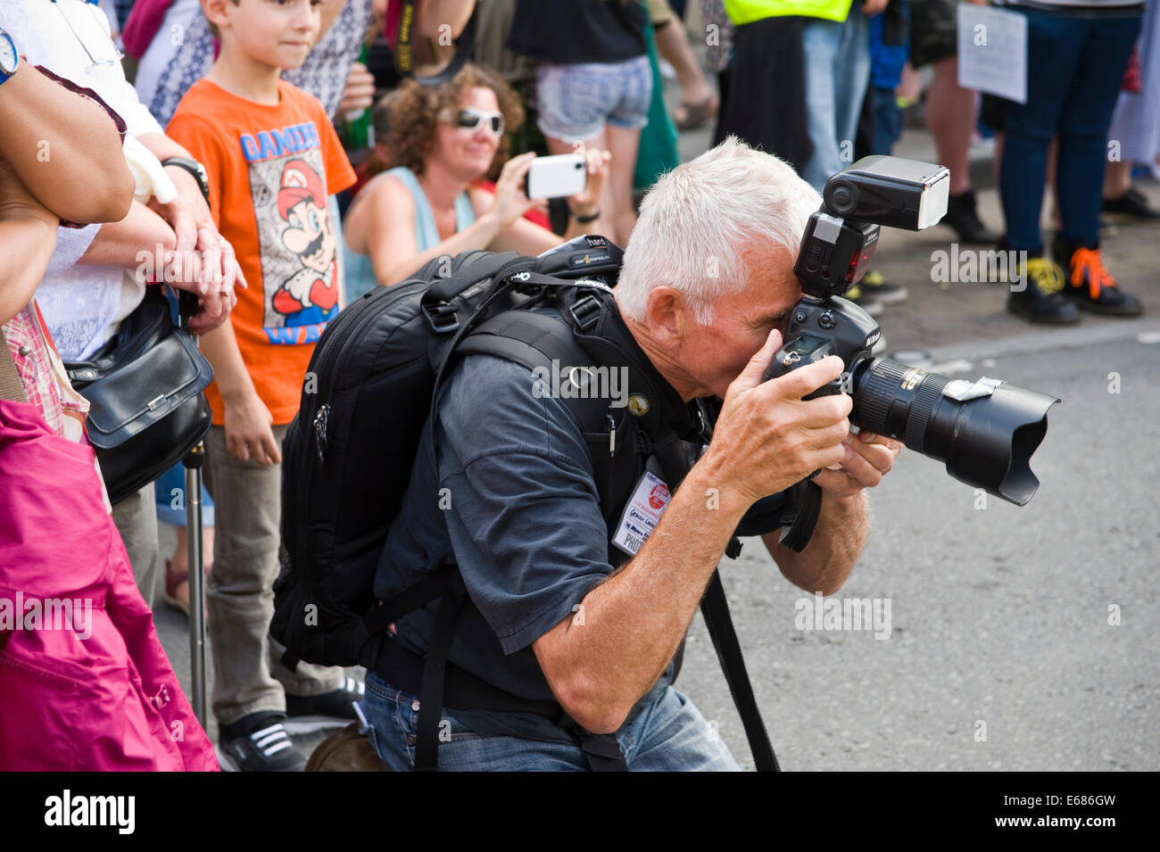 Photographer taking photographs during Brecon Jazz Festival 2014 Stock Photo