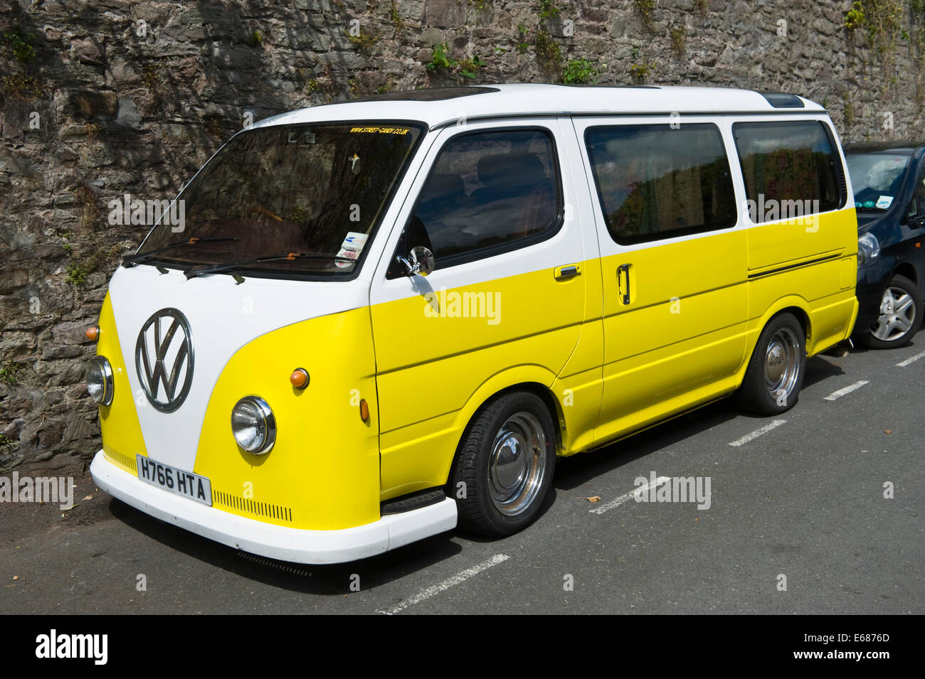 Yellow & white VW camper van parked on the street Brecon Powys Wales UK  Stock Photo - Alamy
