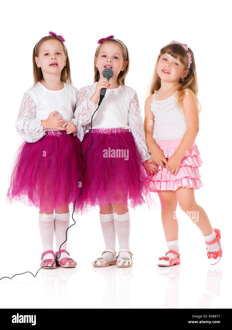 Three little girls Cut Out Stock Images & Pictures - Alamy