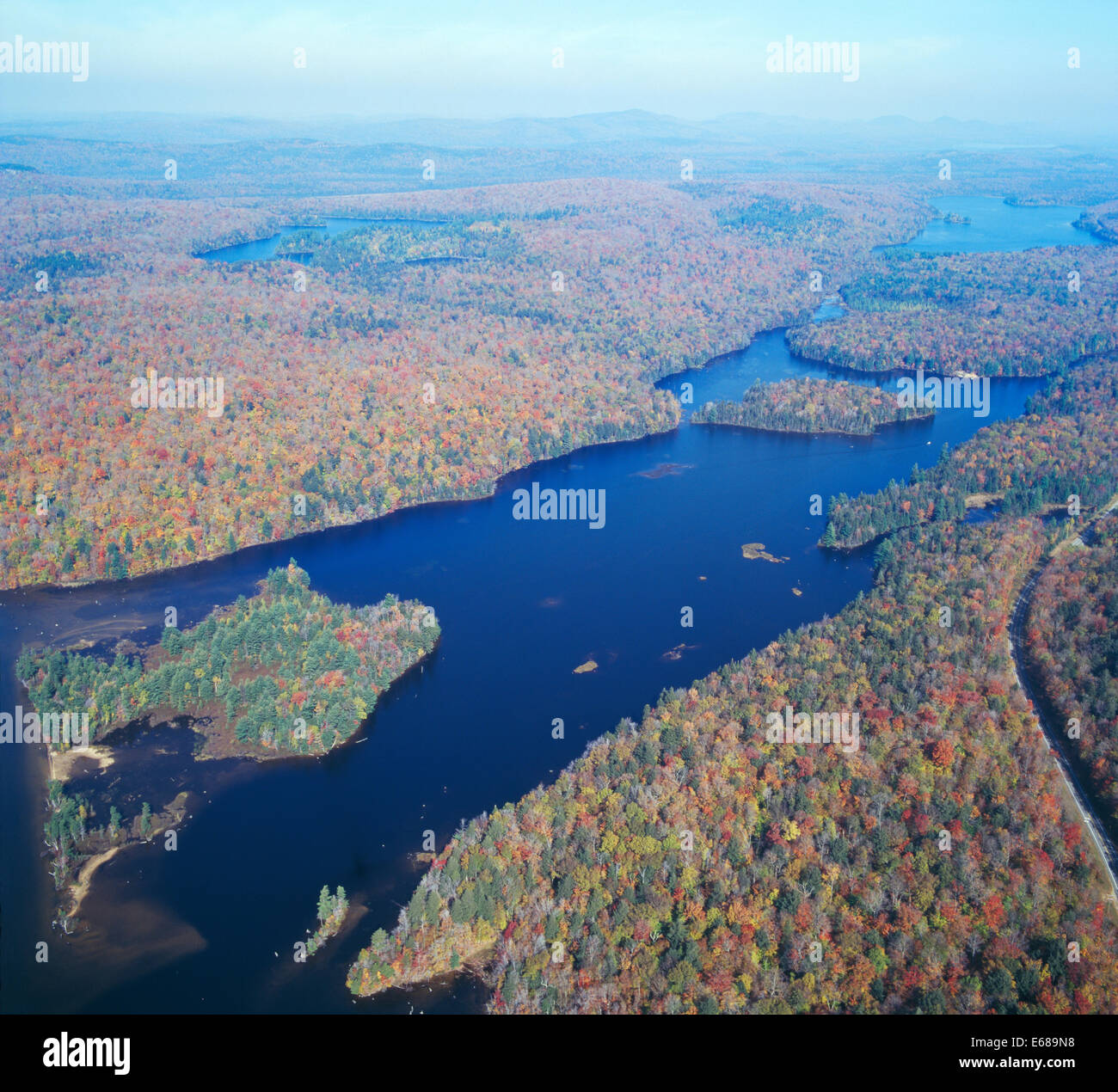colorful autumn woods, islands in the lake (aerial photo of a part of