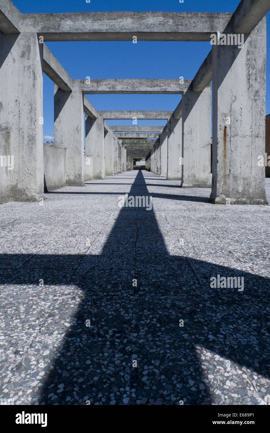 Urban concrete pillars with heavy shadow Stock Photo