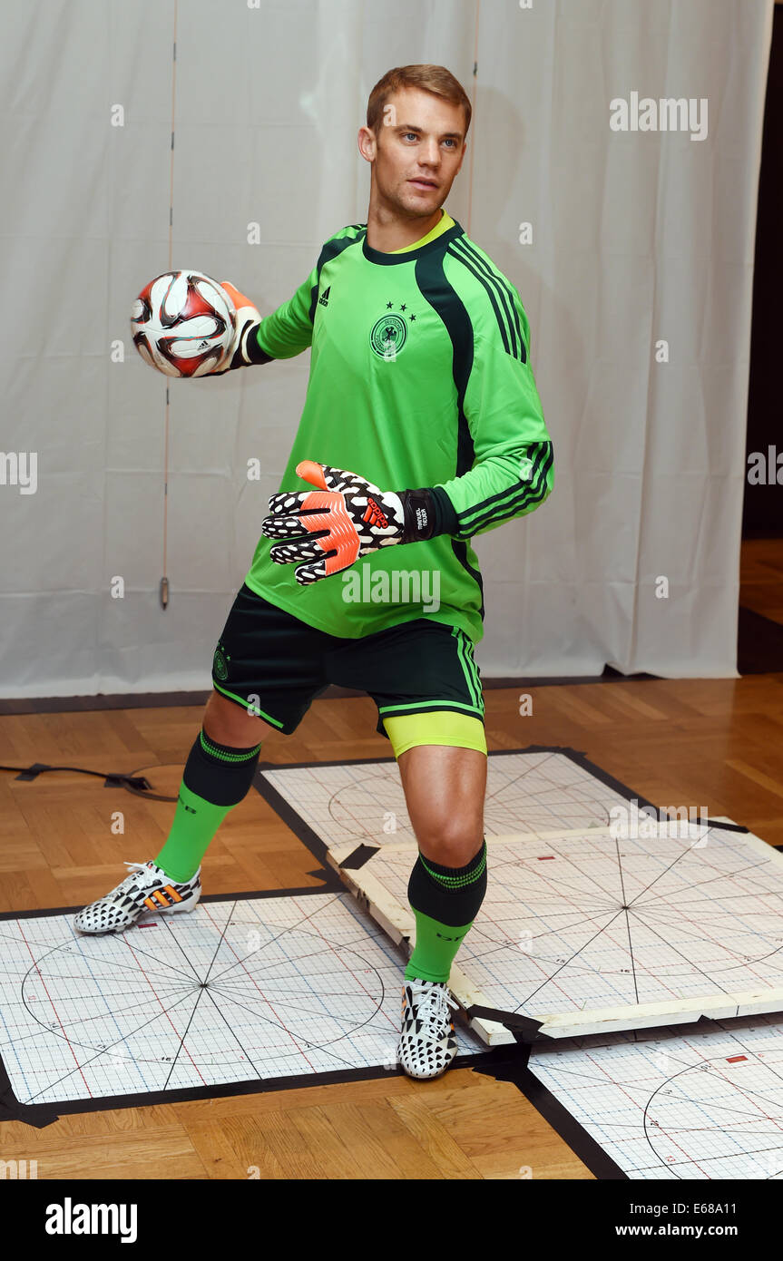 Germany's goal keeper Manuel Neuer poses during the so called sitting for his wax figure in the wax figure cabinet at Madame Tussaud's in Berlin, Germany, 14 August 2014. 226 measurments and around 150 pictures are taken. Eye colour, skin- and hair colour are colour-cordinated in order to create a lifelike wax figure. In four to six months the figure will be presented at Madame Tussaud's in Berlin. Photo: Jens Kalaene/dpa (ATTENTION: EMBARGO, TUESDAY, 19 AUGUST 2014, 00.01) Stock Photo