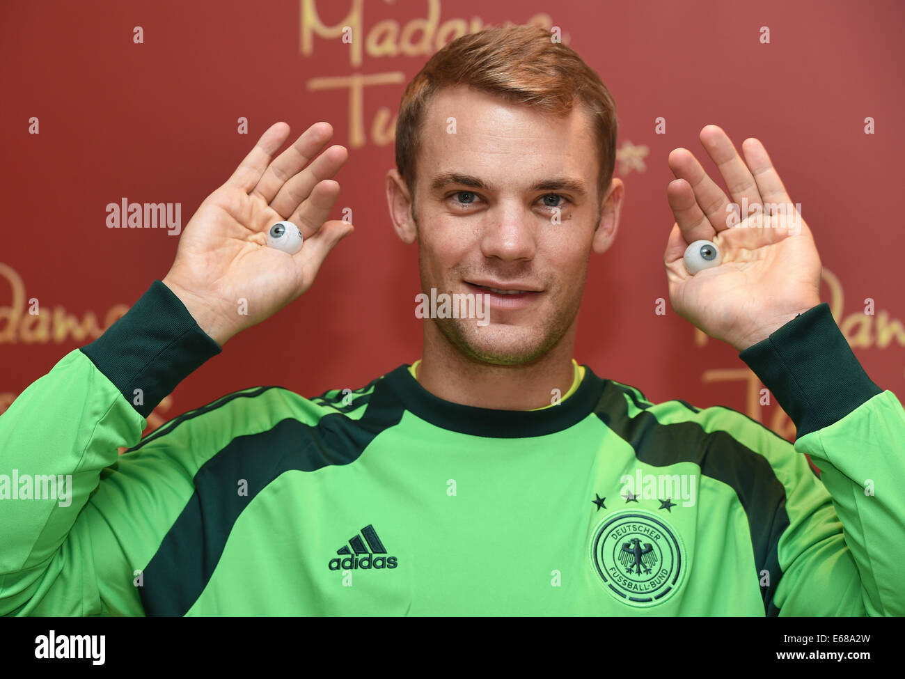 Germany's goal keeper Manuel Neuer poses during the so called sitting for his wax figure in the wax figure cabinet at Madame Tussaud's in Berlin, Germany, 14 August 2014. 226 measurments and around 150 pictures are taken. Eye colour, skin- and hair colour are colour-cordinated in order to create a lifelike wax figure. In four to six months the figure will be presented at Madame Tussaud's in Berlin. Photo: Jens Kalaene/dpa (ATTENTION: EMBARGO, TUESDAY, 19 AUGUST 2014, 00.01) Stock Photo