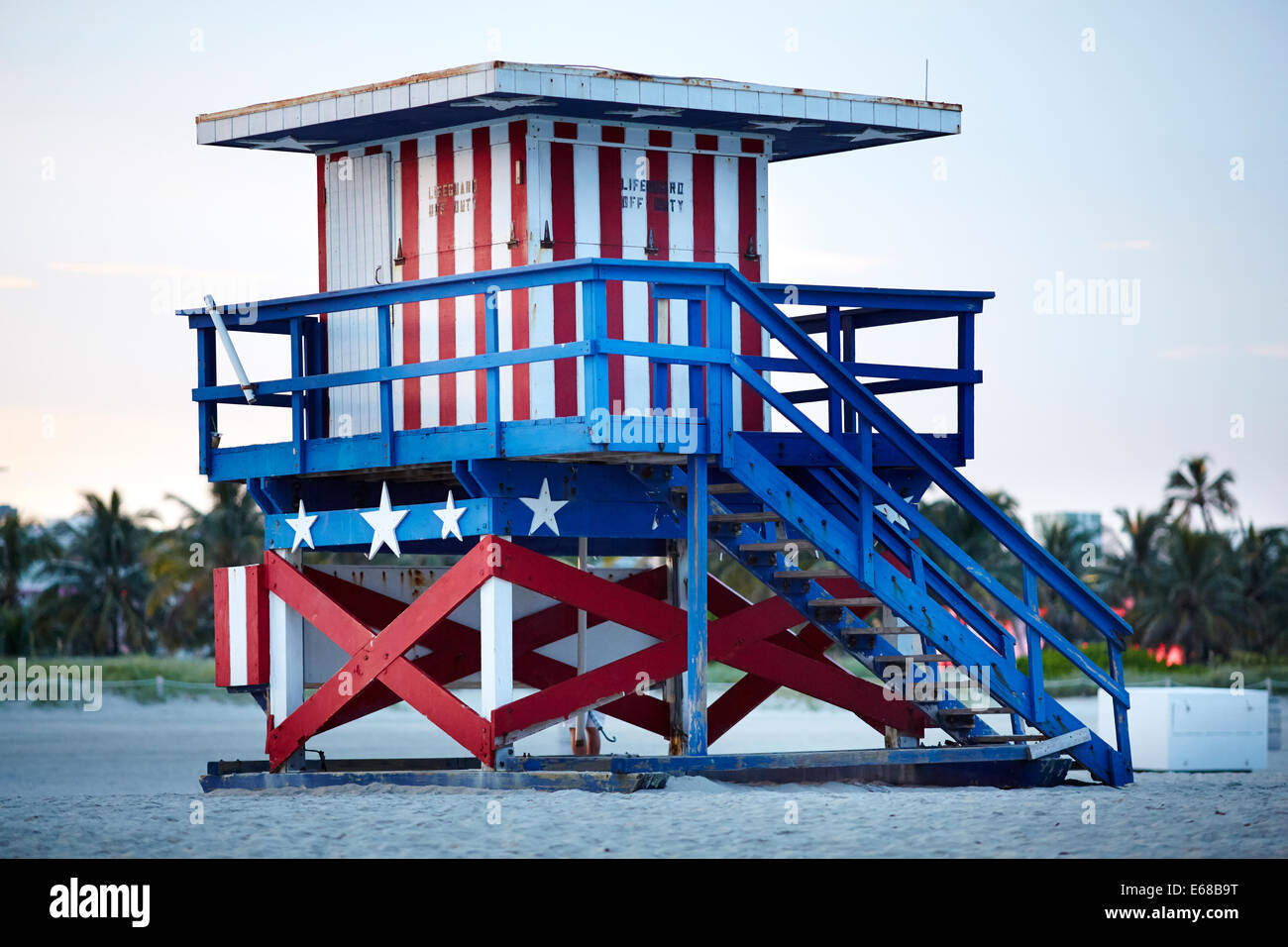 South Beach Ocean Drive  Miami in Florida USA, a lifeguard tower painted in red white and blue stars and stripes colours and daw Stock Photo