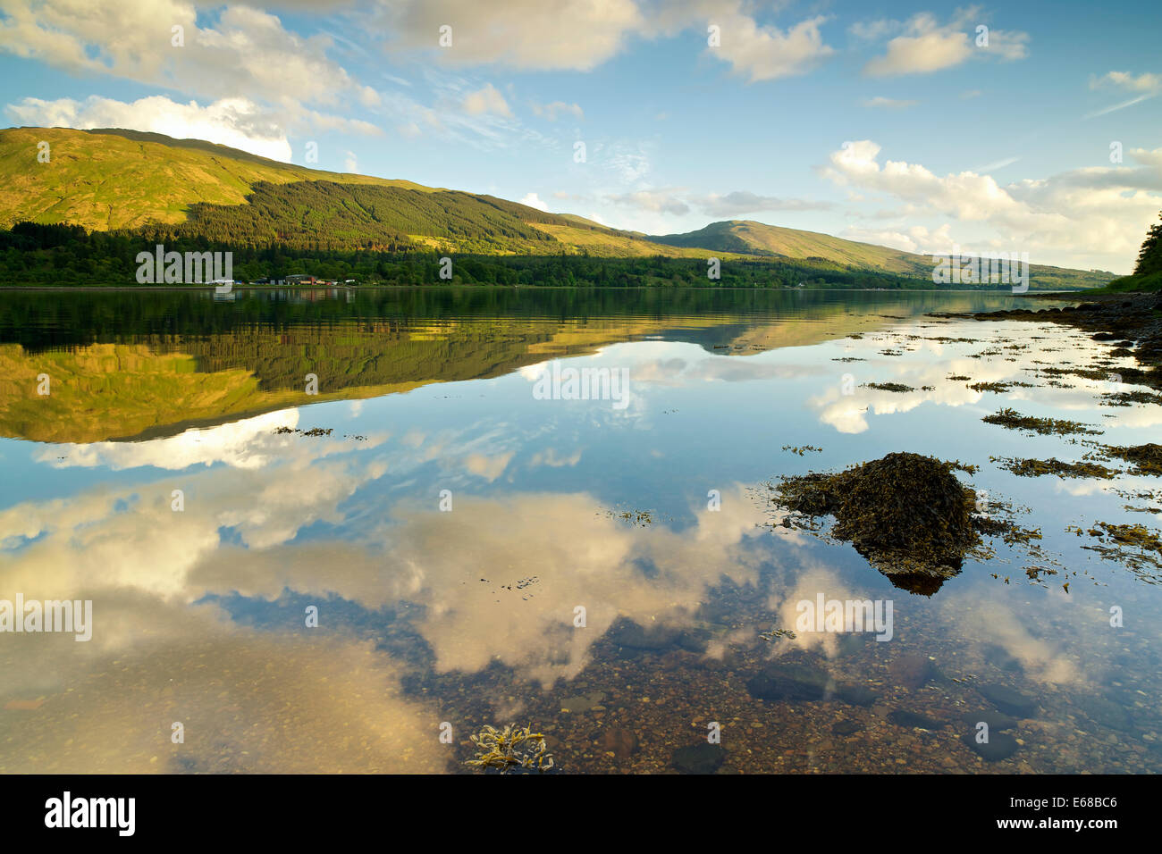 Reflections of the argyll landscape in Loch Fyne Stock Photo