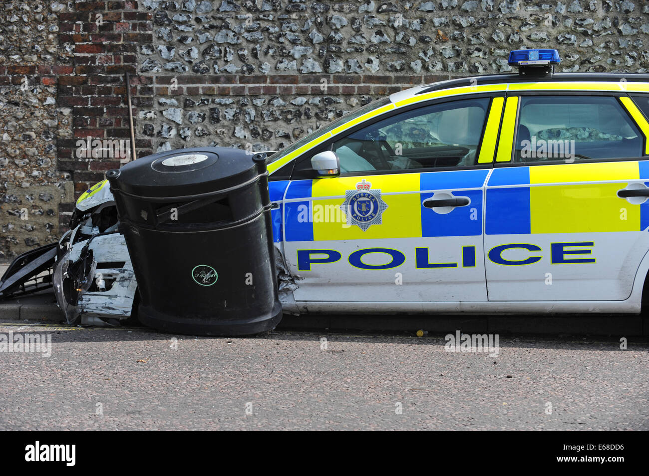 Sussex Police car damaged after a collision with another vehicle whilst in pursuit Stock Photo