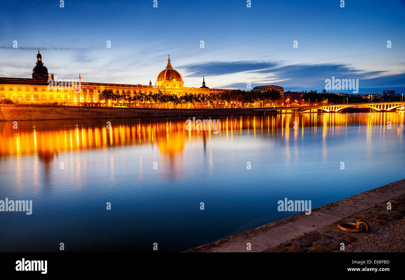 night view from Rhone river in Lyon city with Hotel Dieu and Fourviere cathedral, France Stock Photo