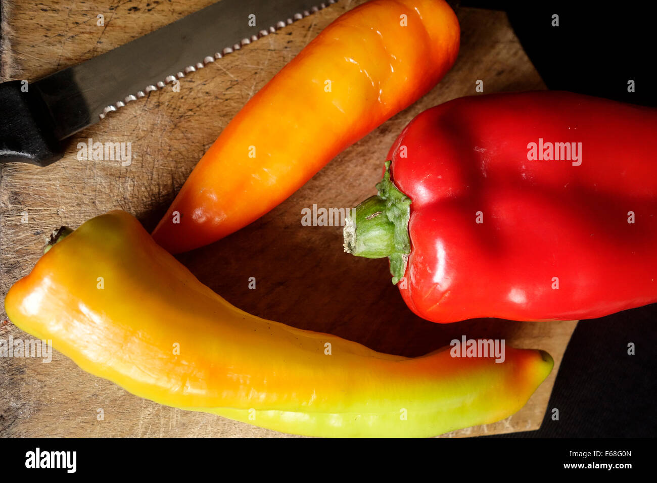 Variety of Chilli Peppers on a Chopping Board Stock Photo - Alamy