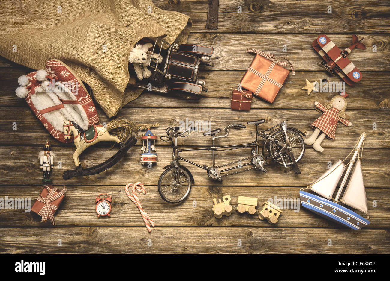 Vintage christmas decoration: old nostalgic children toys on wooden rustic background. Stock Photo