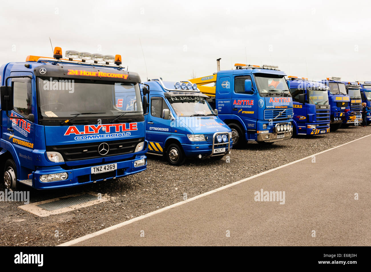 A row of recovery tow trucks parked up Stock Photo
