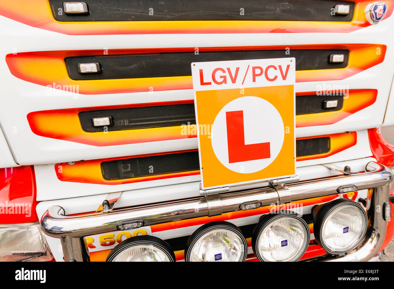 A colourful Scania semi articulated tractor cab with a learner LGV PGV badge. Stock Photo