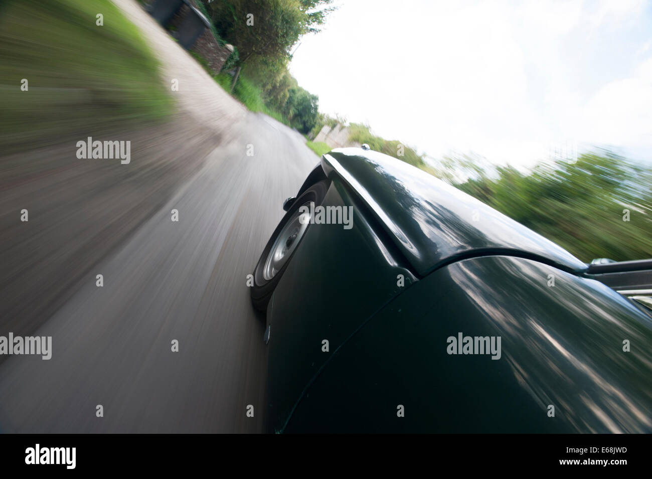 Car driving fast on country road Stock Photo Alamy