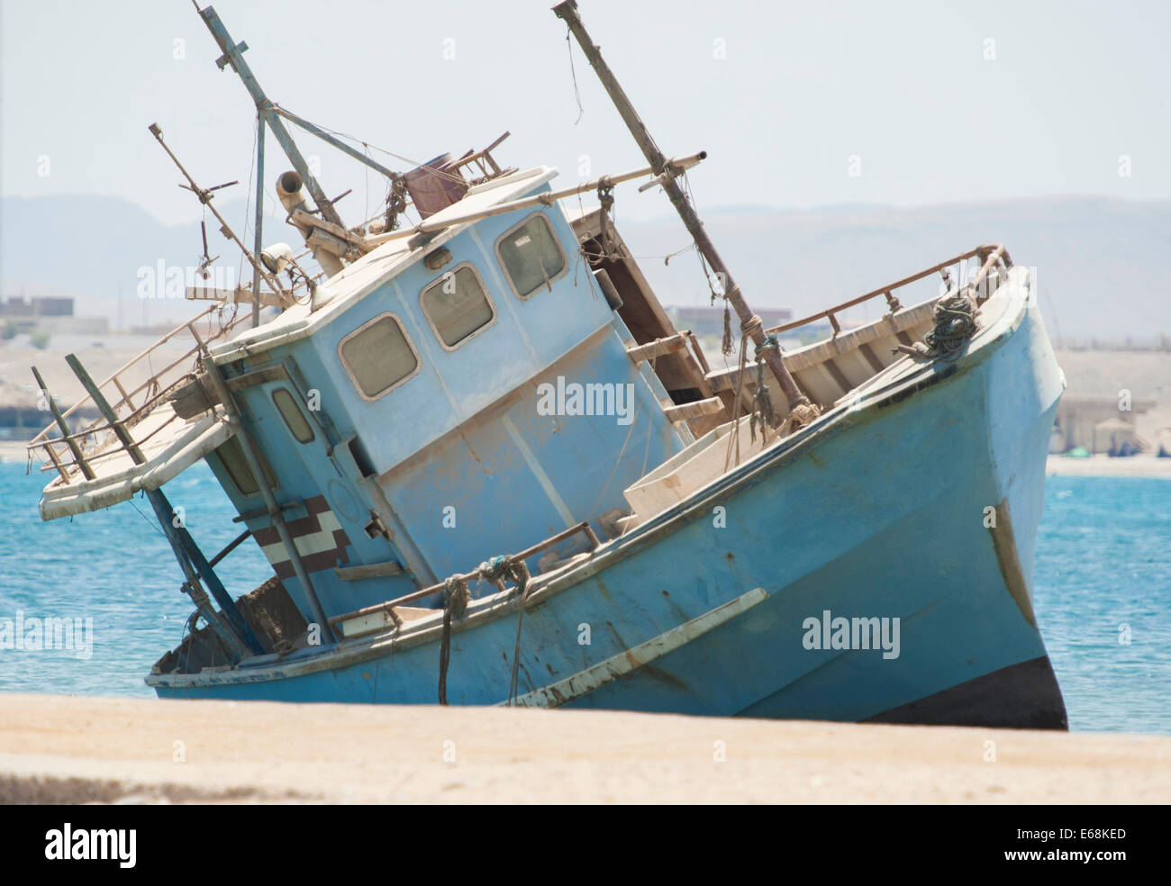 Old abandoned derelict fishing boat wreck in port Stock Photo - Alamy
