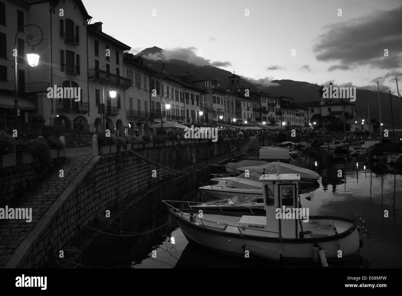 Cannobio harbour at sunset, black and white image, Lake Maggiore Stock Photo