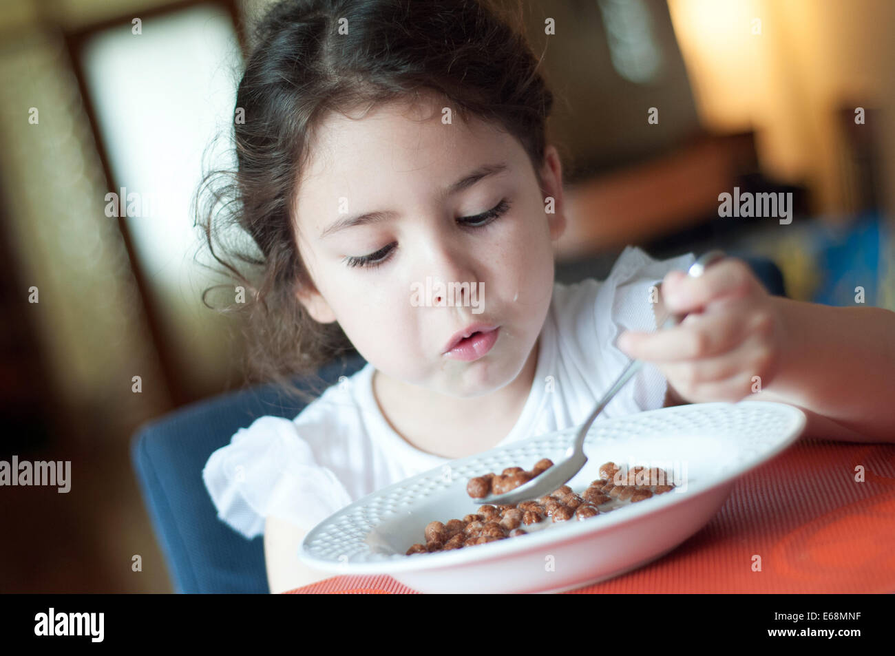 Child eating cereals Stock Photo Alamy