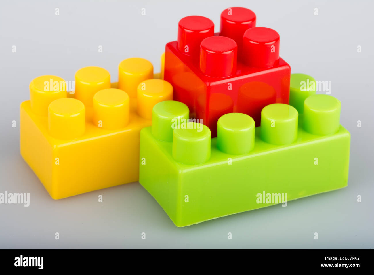 A stack of three plastic colored cubes isolated Vector Image