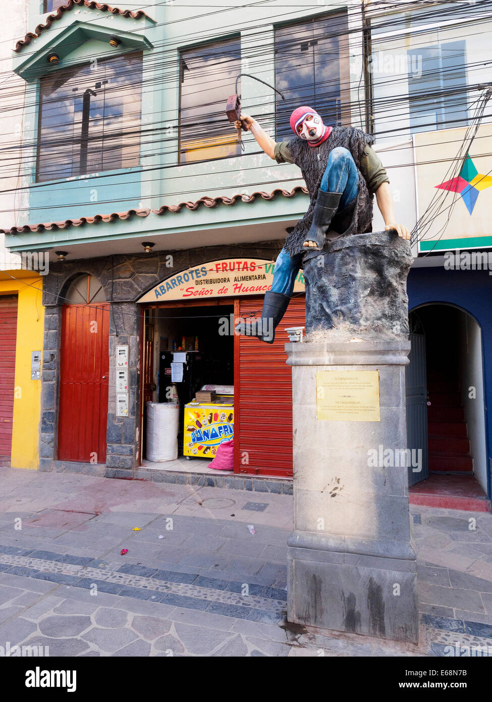 Statue of 'El Chanchanmacho' - Chivay, Peru El Chanchanmacho its a humorous character, playful wgo goes opening espace for the Turko's dancers. He has to ridicule viewer people and the people from the town. Some people say he is the thief of beautiful women. Stock Photo