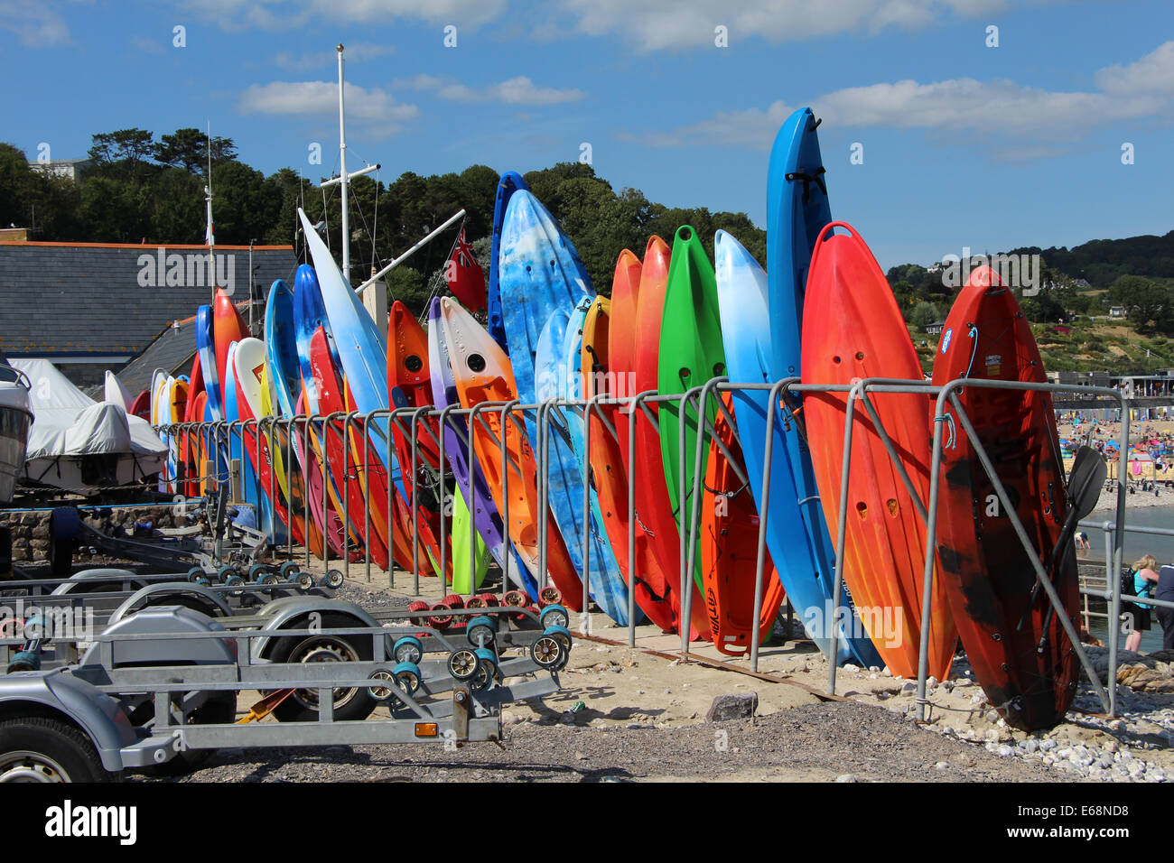 Canoes / kayak stacked in a rack at Dorset fishing port of Lyme Regis