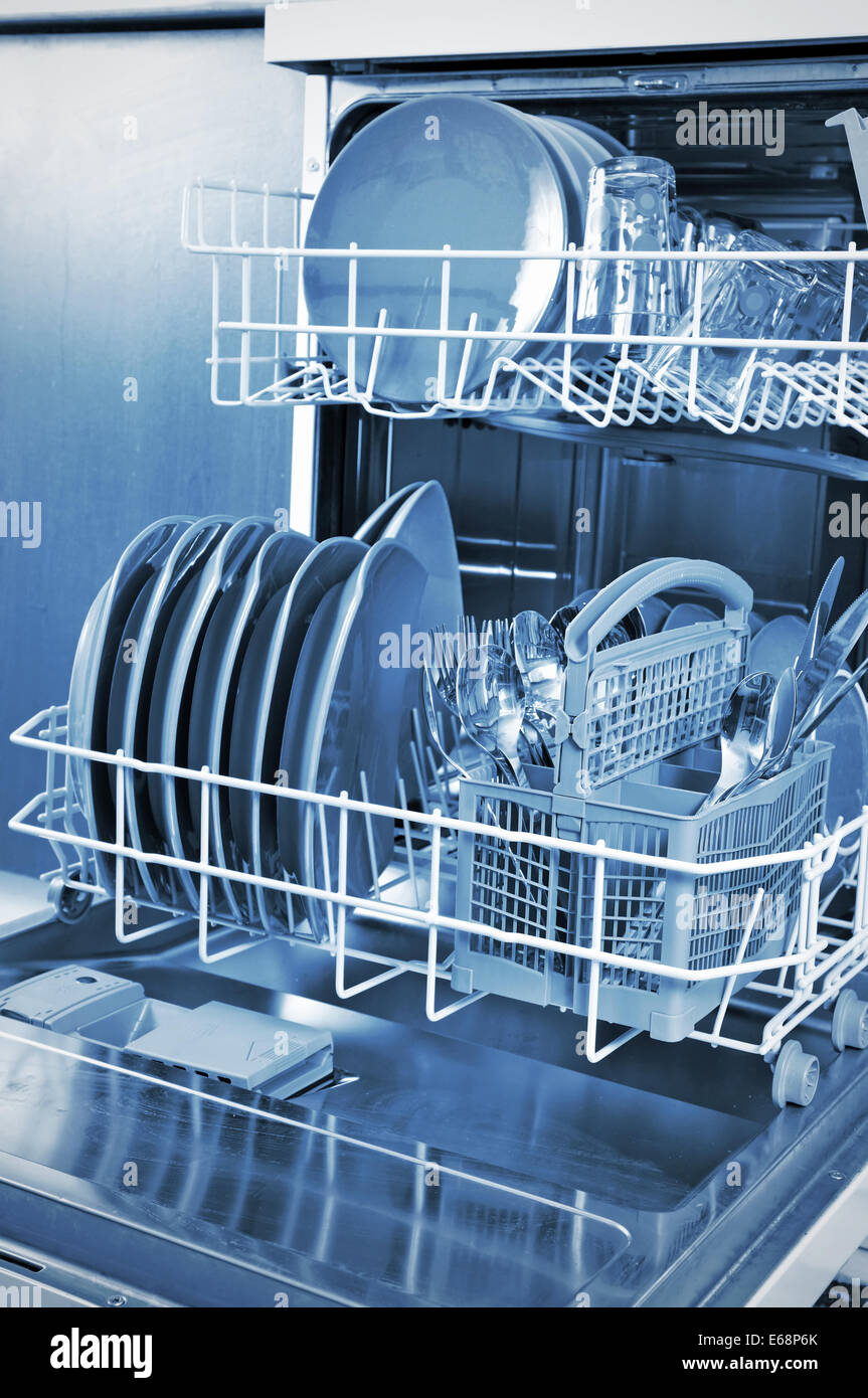 Inside a dishwasher and dishes in the kitchen Stock Photo Alamy